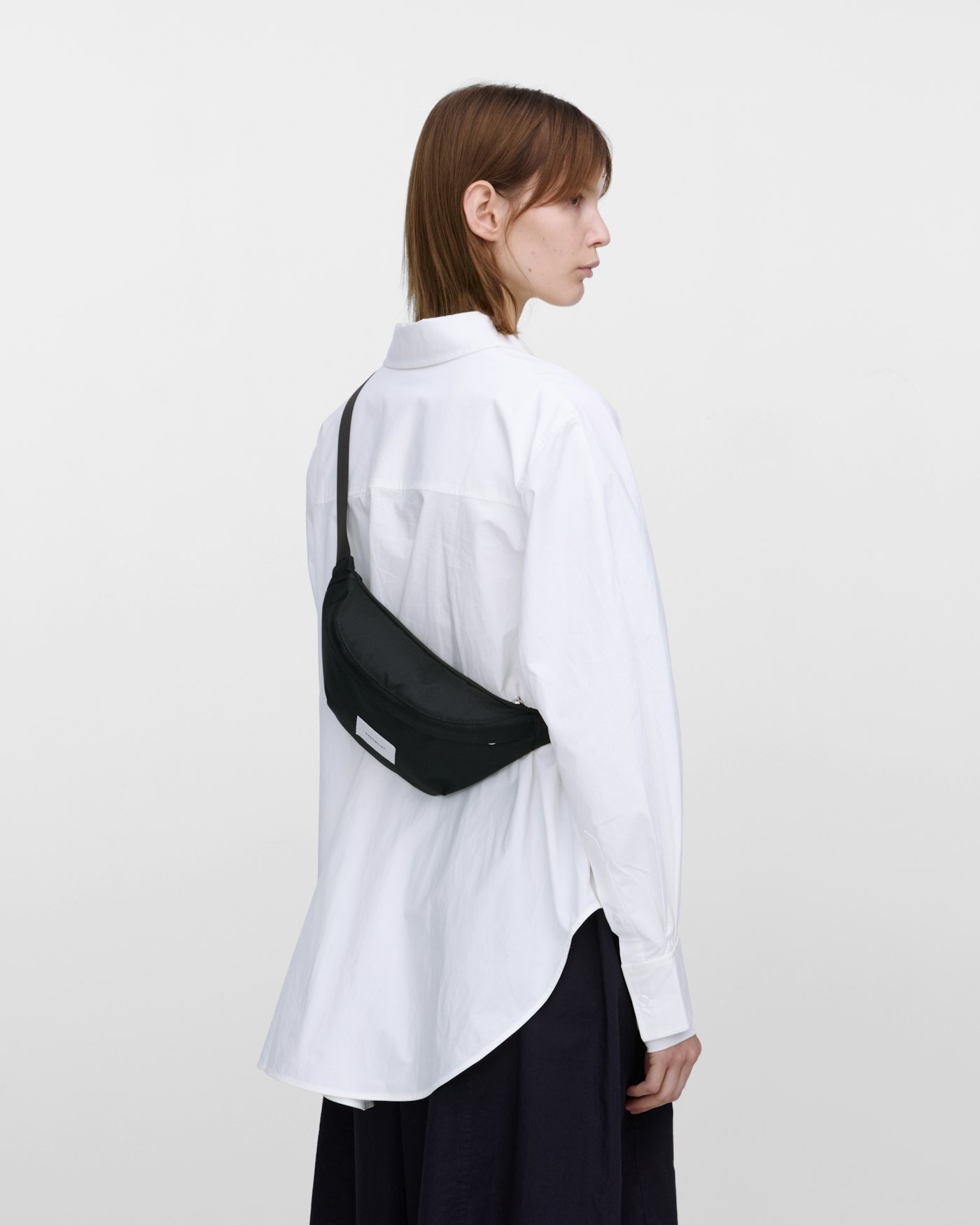 GROUND crossbody bag is in color black (11 of 11)