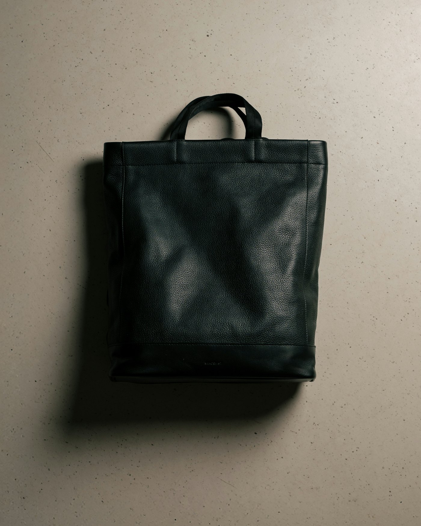 Leather Tote Backpack is in color black (6 of 9)