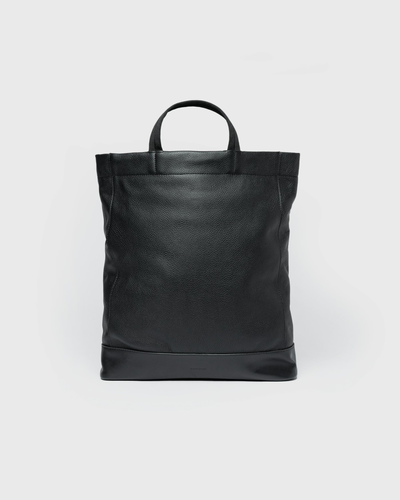 Leather Tote Backpack is in color black (1 of 9)