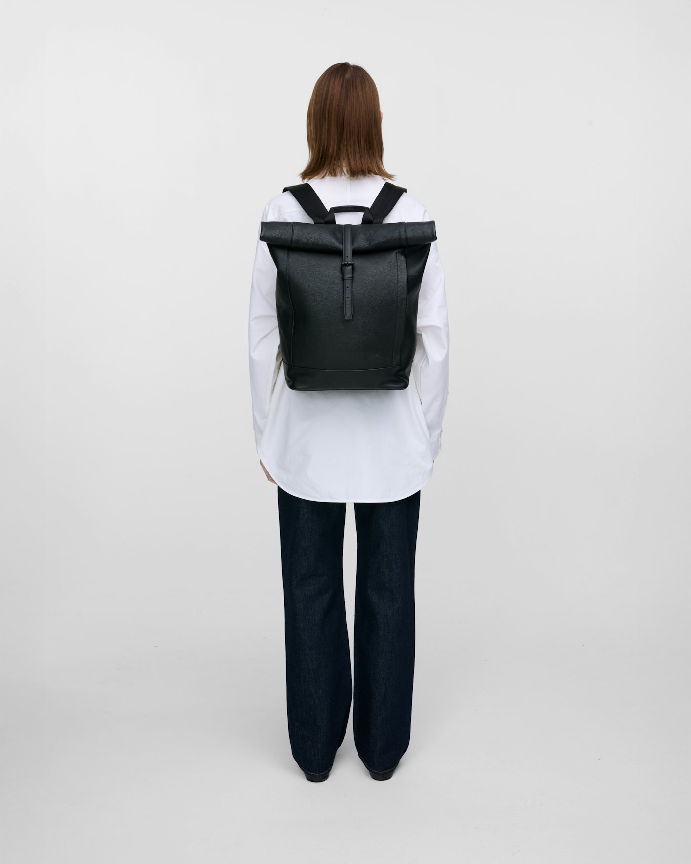 Leather rolltop backpack is in color black (6 of 15)