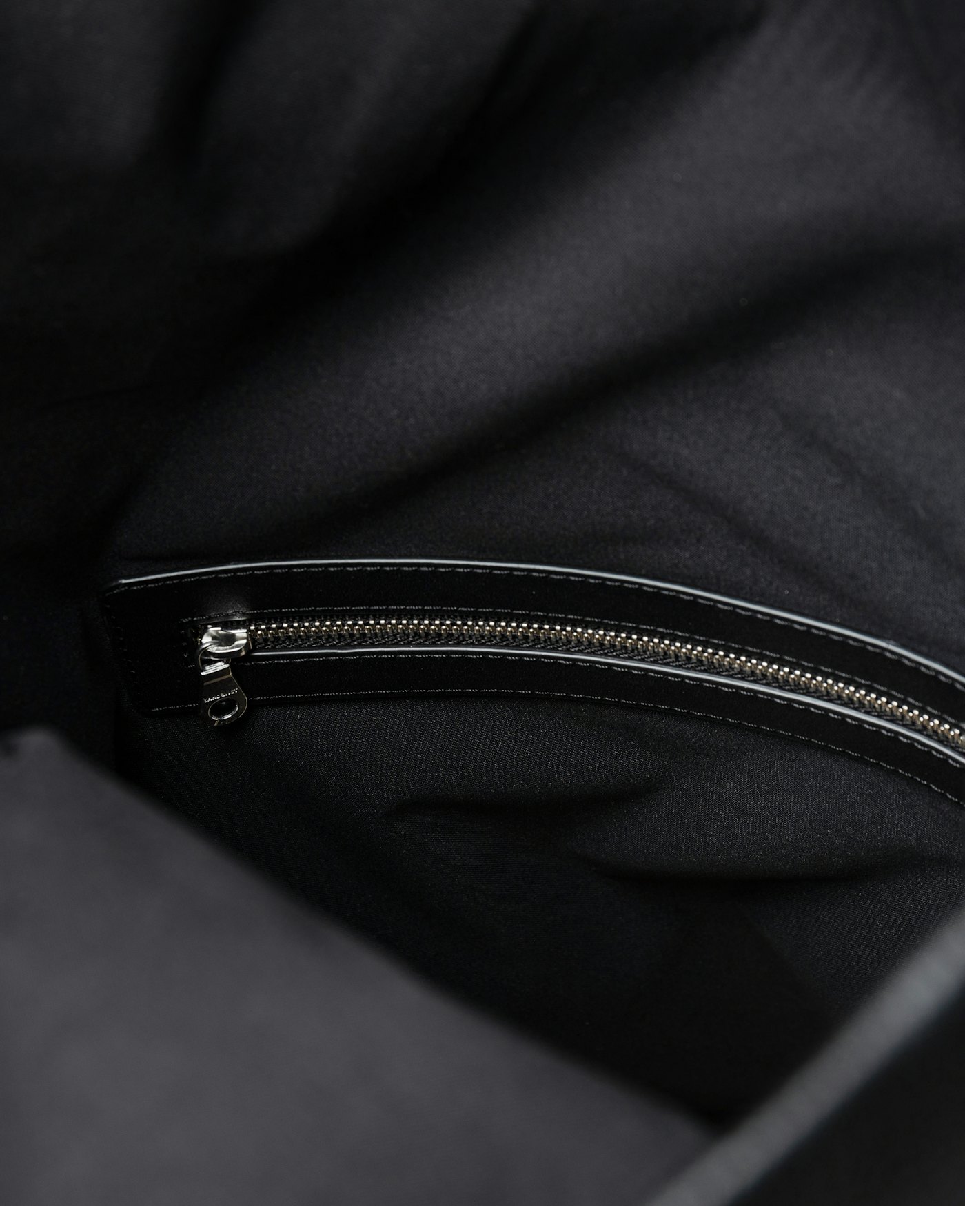 Leather rolltop backpack is in color black (5 of 15)