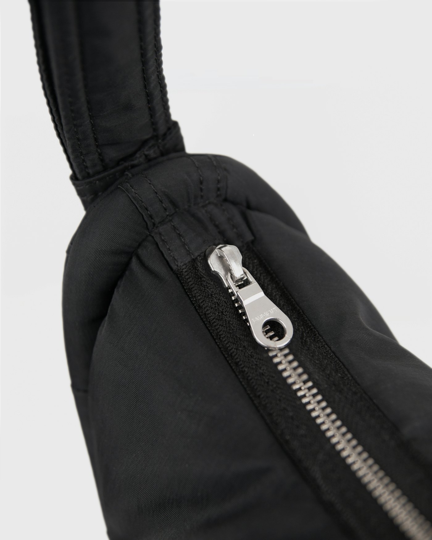 CURVE Half Moon Bag Mini is in color black (5 of 17)