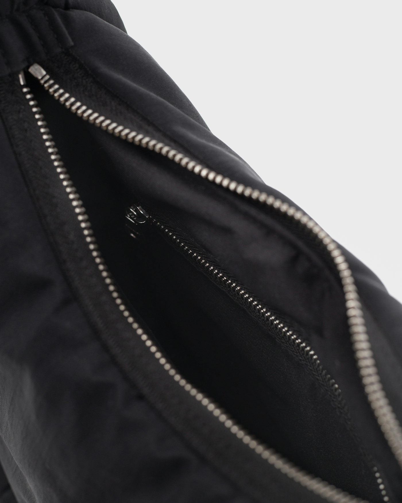 CURVE Half Moon Bag Mini is in color black (6 of 17)